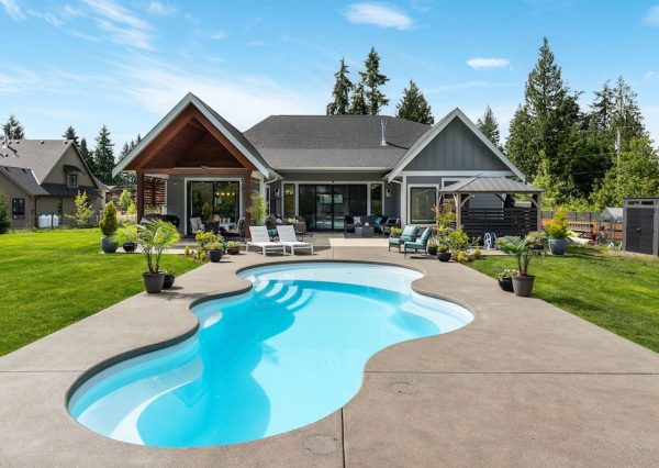 Custom home design with unique shaped pool