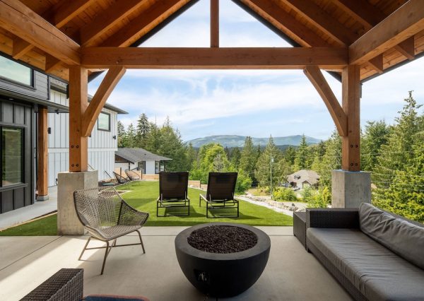 Large beams on timber frame patio with gas fire bowl for outdoor living