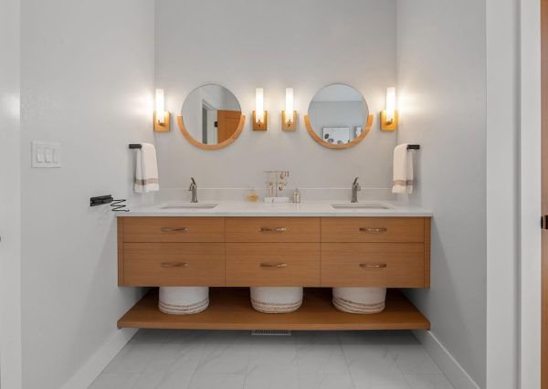 Custom built in wood vanity with circle windows