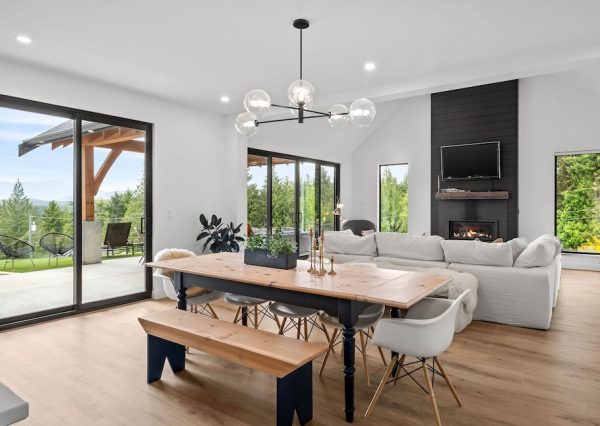 Dining room with tall ceilings and sliding patio door