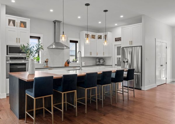 Kitchen with gold hardware and pendant lights