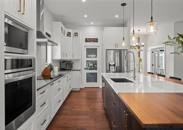 Custom kitchen with white and wood cabinets and large kitchen island