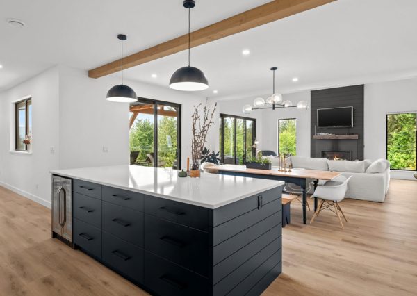 Open concept kitchen, dining and living room in custom home in Shawnigan Lake