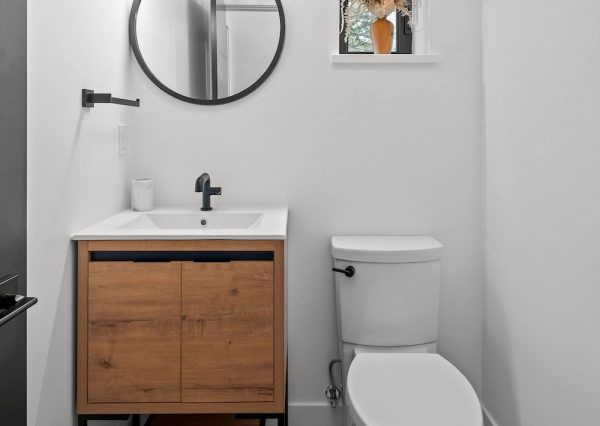 Small powder room with black and white floor tile