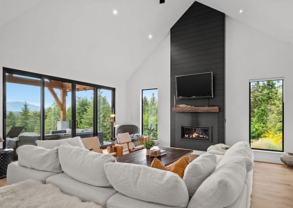 Open concept home with tall, vaulted ceilings and large sliding patio door