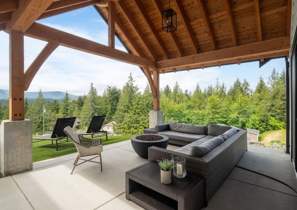 Timber framed covered patio with gas fireplace in Shawnigan Lake