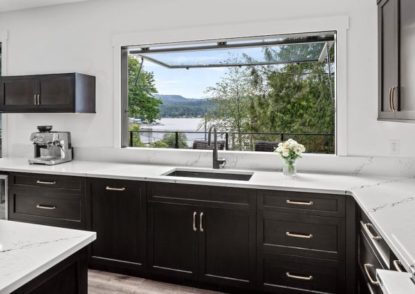 Pass through window in kitchen with lake views