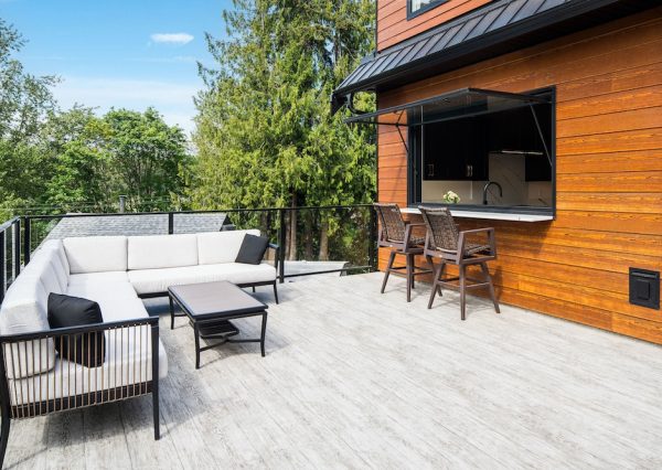 Pass through window to vinyl deck with glass railings