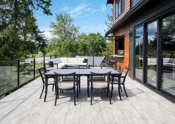 Outdoor entertaining space on large deck with pass through window