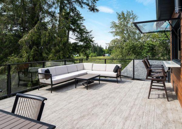 Large patio with pass through window and glass railings