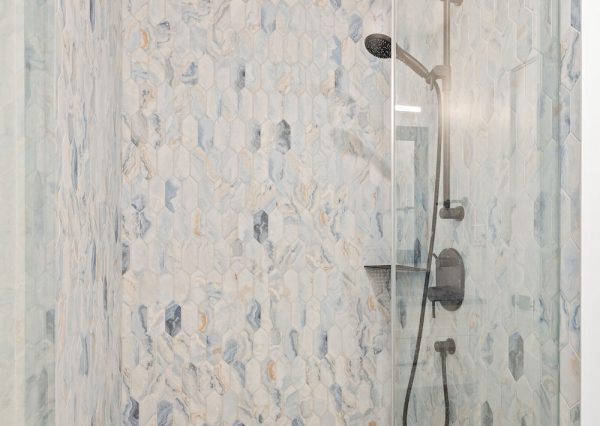Custom tiled shower with blue tiles
