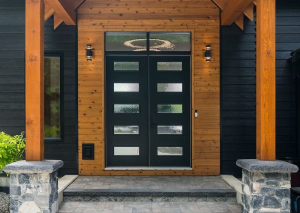 Timber frame covered front entrance with black front door
