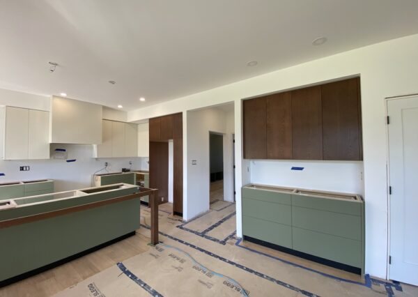 Wood, green and cream kitchen cabinets