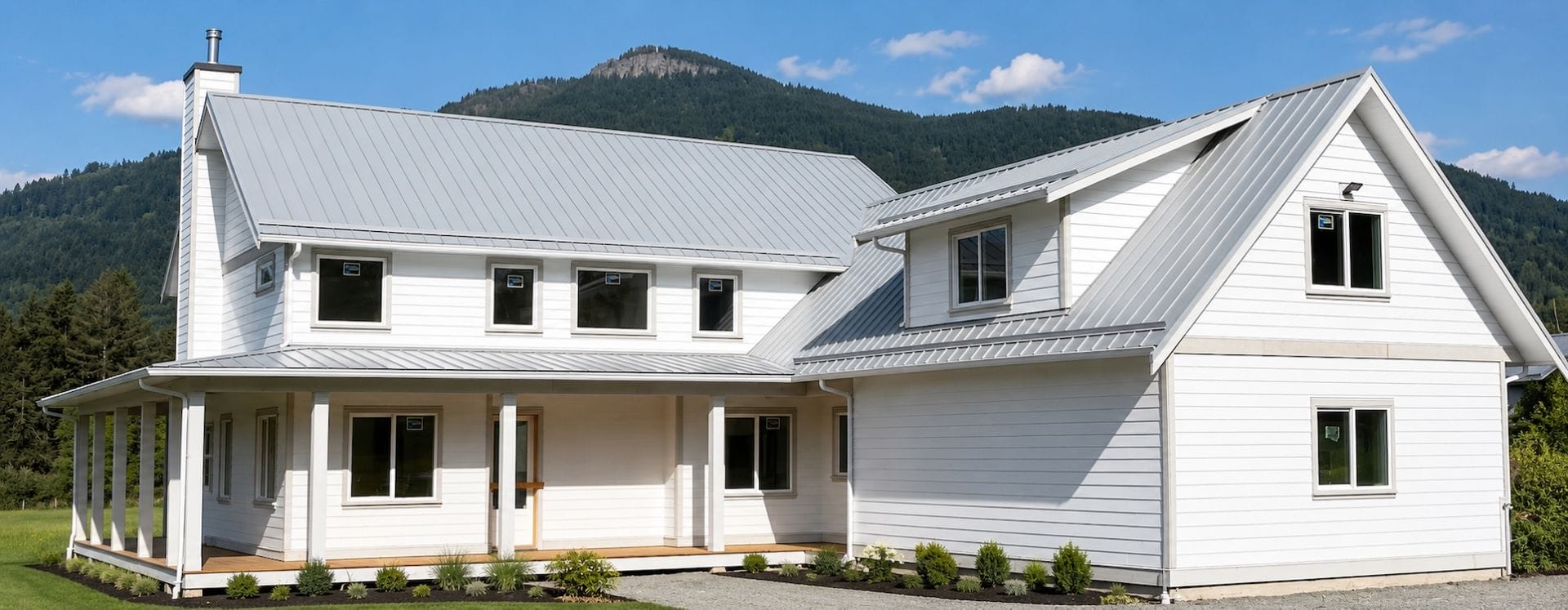 Modern farmhouse custom home in the Cowichan Valley with Mount Prevost in the background
