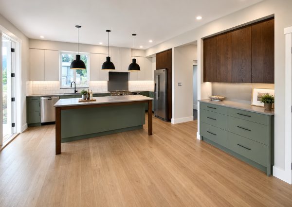 Modern farmhouse kitchen with sage green cabinetry and large island