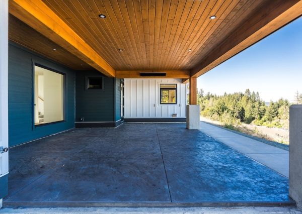 Covered outdoor living area with wood ceiling at The Inlet