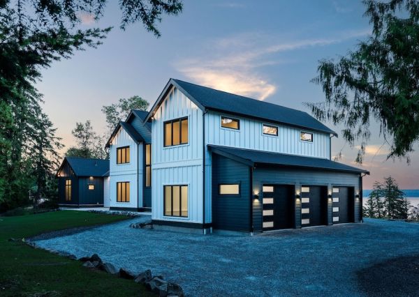Three-car garage and modern exterior of The Inlet custom home
