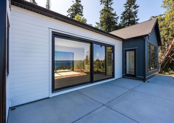 Outdoor patio with large sliding glass doors at The Inlet